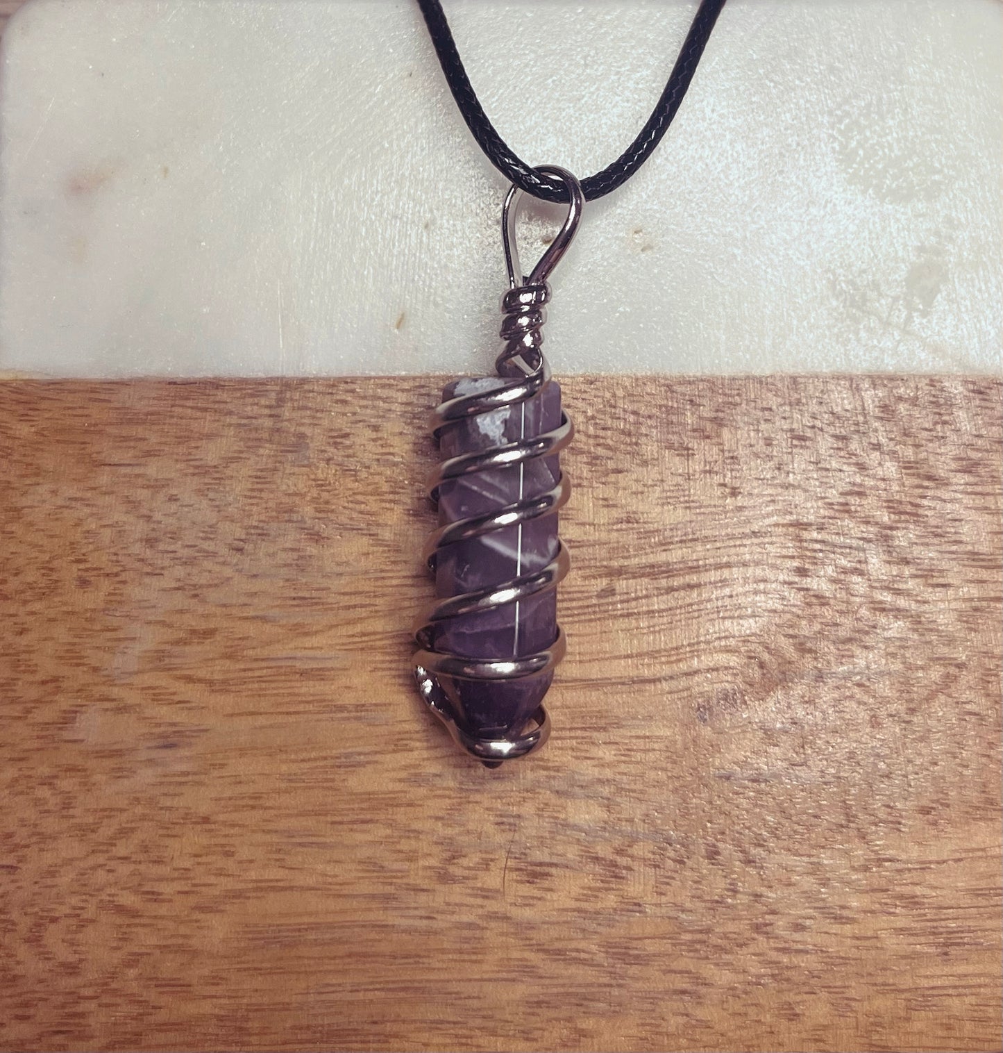 Beauty Marked: Amethyst Spiral Crystal Necklace